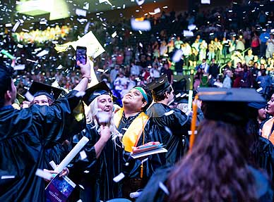 Students celebrating at graduation