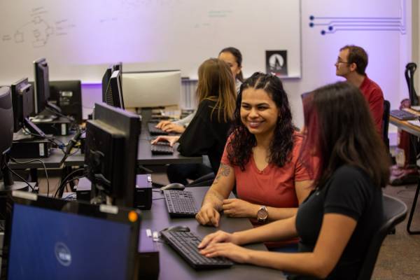 Pima staff speaks to student